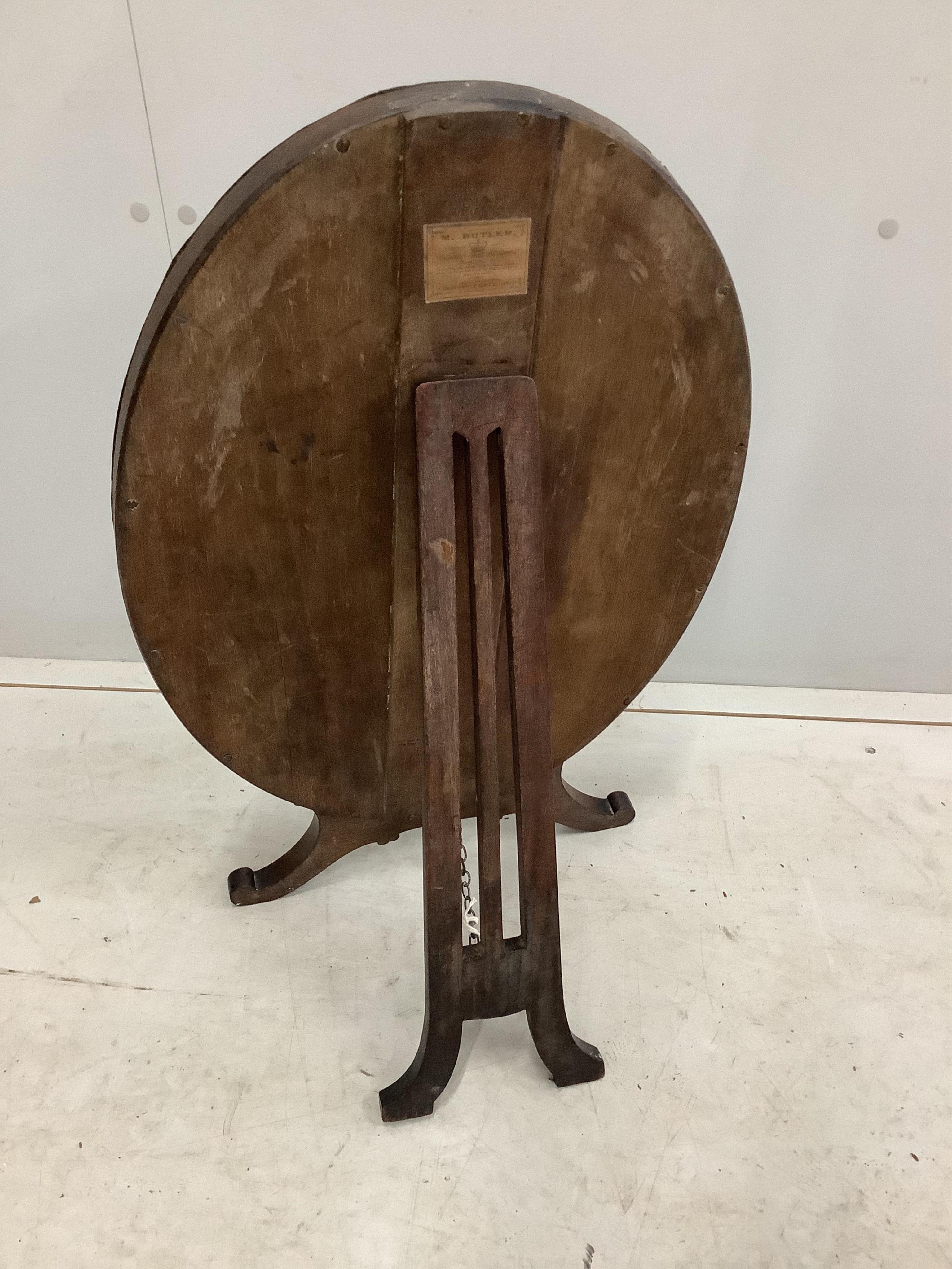 An early 20th century Irish glass bead applied mahogany toilet mirror, modelled in the 18th century manner and with label for M Butler of Dublin, width 40cm, height 62cm. Condition - fair